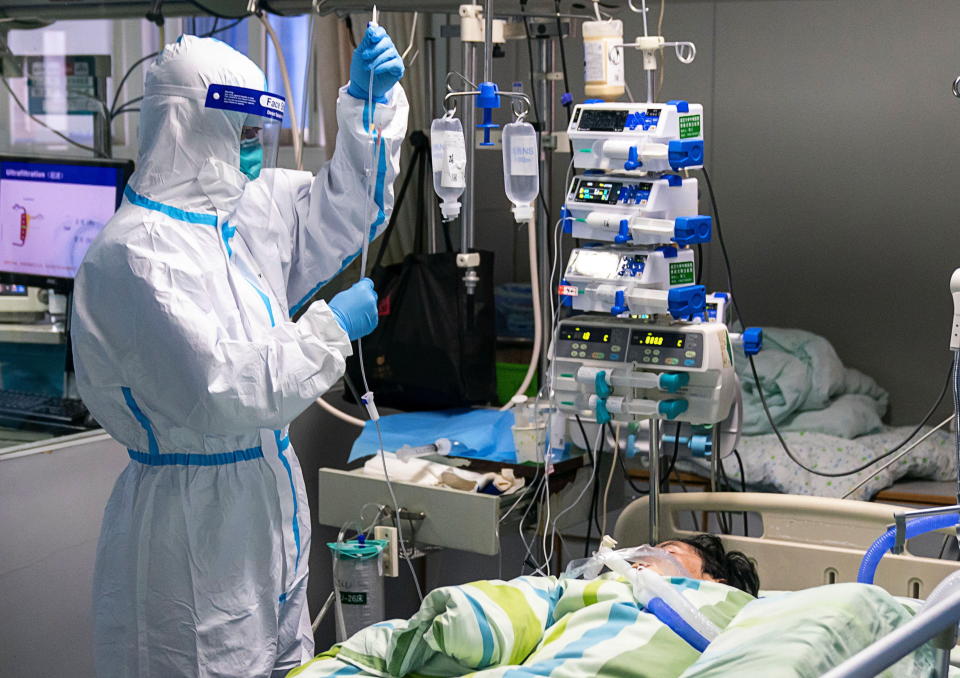 A medical worker checking the drip of a patient in the Intensive Care Unit (ICU) of Zhongnan Hospital of Wuhan University in Wuhan. Source: AAP