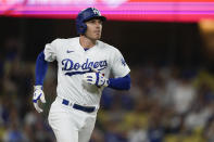 Los Angeles Dodgers' Freddie Freeman watches his two-run home run against the Arizona Diamondbacks during the third inning of a baseball game Wednesday, Aug. 30, 2023, in Los Angeles. Mookie Betts also scored. (AP Photo/Ryan Sun)