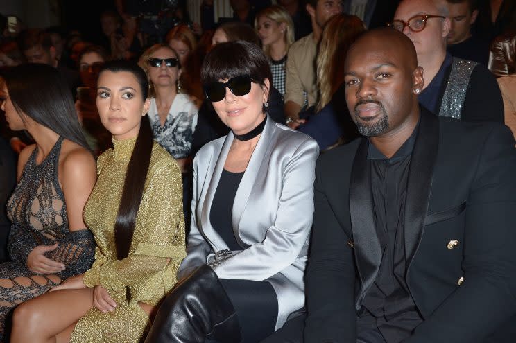 Kourtney Kardashian, Kris Jenner, and Corey Gamble at the Balmain show.<br>(Photo: Getty Images)