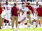 Oklahoma quarterback Spencer Rattler (7) carries the ball during the first half of an NCAA college football game against TCU, Saturday, Oct. 24, 2020, in Fort Worth, Texas. (AP Photo/Brandon Wade)