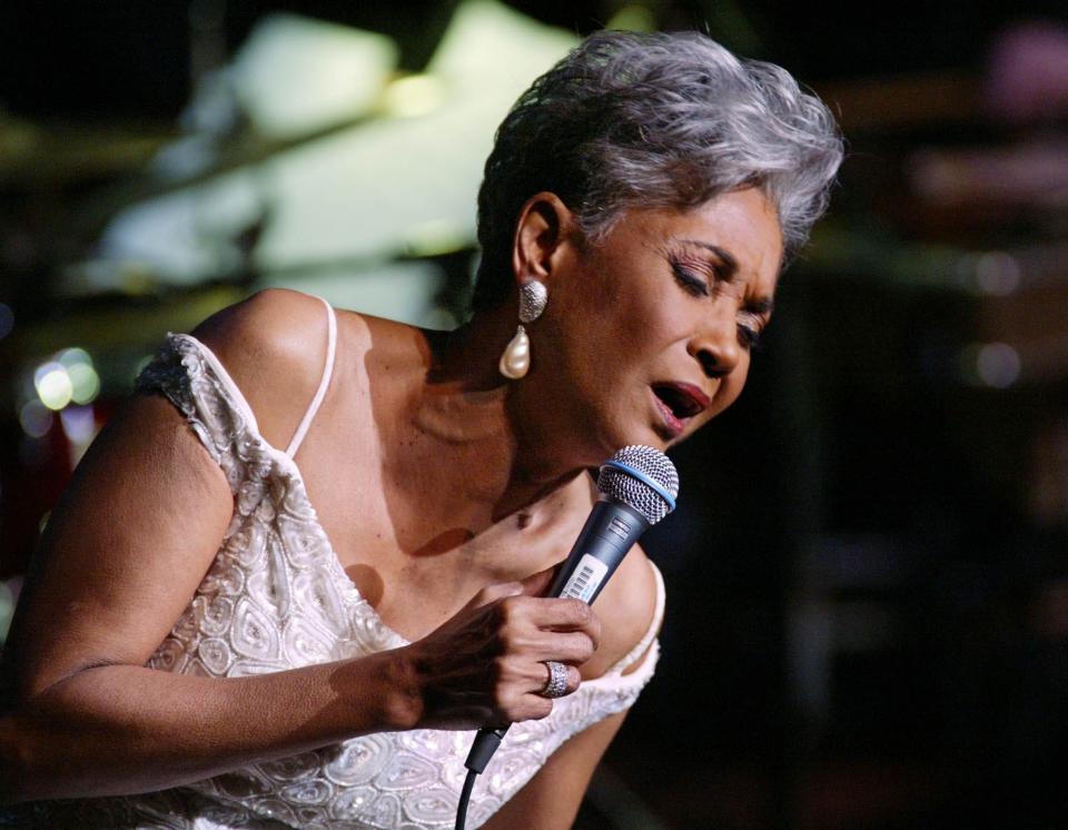 Grammy Award winner and legendary vocalist Nancy Wilson performs at the Lincoln Center's Avery Fisher Hall in New York during a concert titled "Nancy Wilson with Strings: Celebrating Four Decades of Music" in 2003.