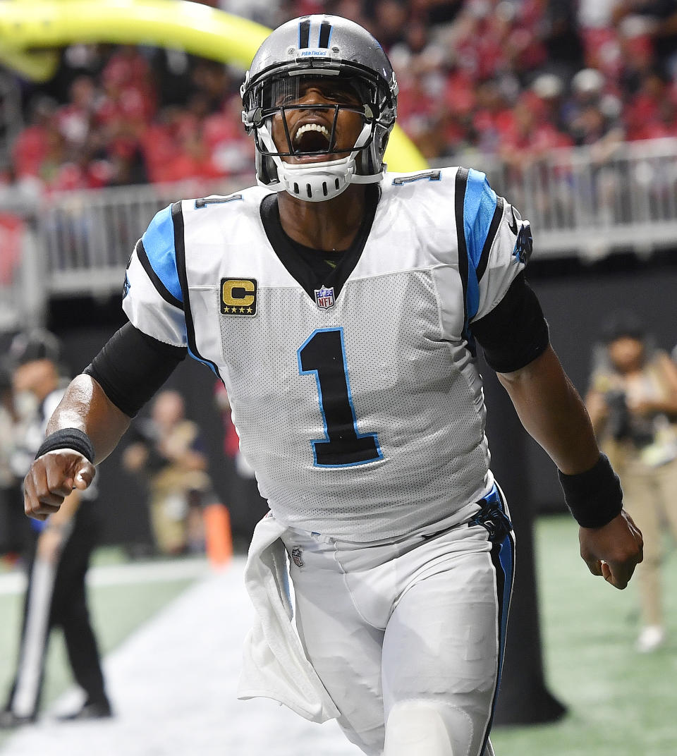 Carolina Panthers quarterback Cam Newton (1) celebrates a touchdown by Carolina Panthers wide receiver Torrey Smith during the second half of an NFL football game against the Atlanta Falcons, Sunday, Sept. 16, 2018, in Atlanta. (AP Photo/John Amis)