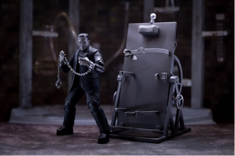 Jada Toy's deluxe greyscale Frankenstein's Monster figure with operating table and accessories