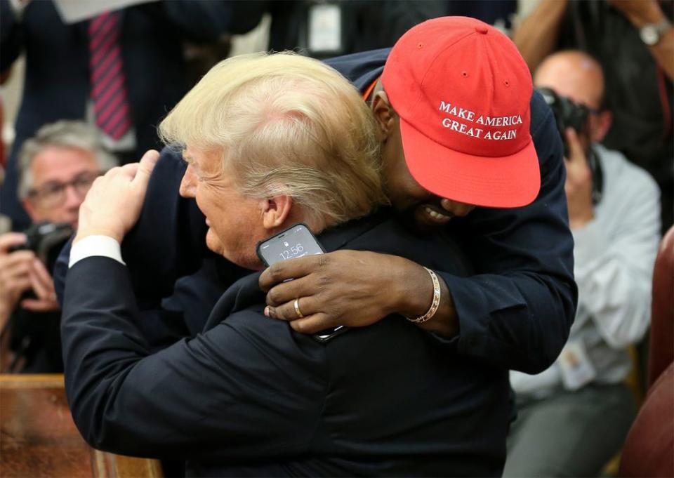 Kanye West greets President Donald Trump with a hug in the Oval Office on Oct. 11, 2018.