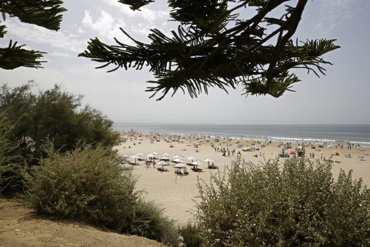 A view of Carcavelos beach in Carcavelos, outside Lisbon, Saturday, Aug. 14, 2021. (AP Photo/Armando Franca)