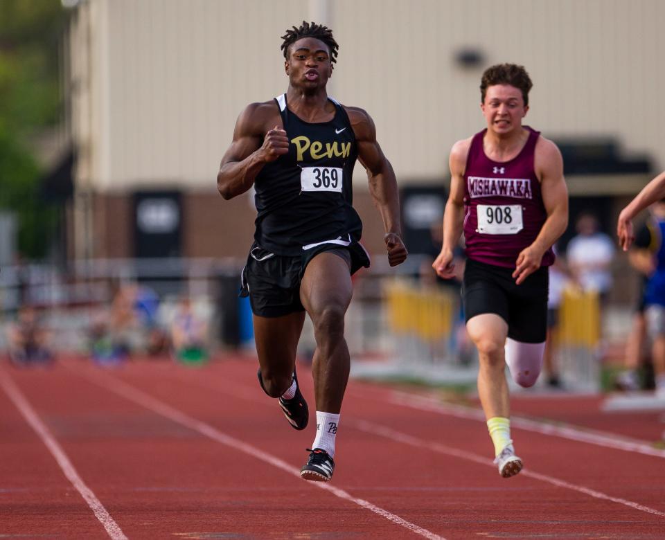 Penn's Josiah Williams, shown in May of 2021, won two events and anchored a record-setting relay team to lead the Kingsmen past Elkhart in the high school boys track Northern Indiana Conference meet Thursday night.