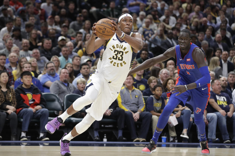 Indiana Pacers' Myles Turner (33) goes to the basket against Detroit Pistons' Thon Maker (7) during the second half of an NBA basketball game, Wednesday, Oct. 23, 2019, in Indianapolis. Detroit won 119-110. (AP Photo/Darron Cummings)