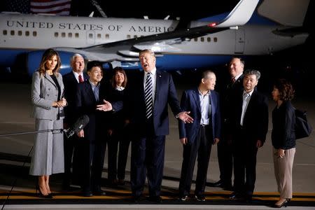 President Donald Trump talks to the media next to the three Americans formerly held hostage in North Korea, Tony Kim, Kim Hak-song and Kim Dong-chul, upon their arrival at Joint Base Andrews, Maryland, U.S., May 10, 2018. REUTERS/Joshua Roberts
