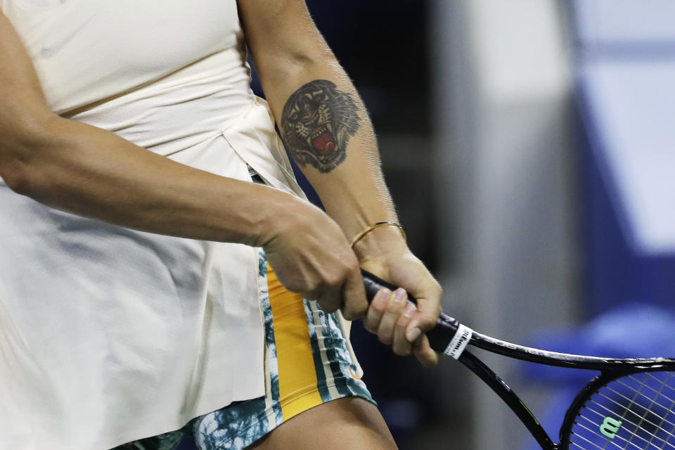 Aryna Sabalenka, of Belarus, has a tiger tattoo on her arm as she plays Petra Kvitova, of the Czech Republic, in a third-round match at the U.S. Open tennis tournament Saturday, Sept. 1, 2018, in New York. Sabalenka won 7-5, 6-1. (AP Photo/Mark Lennihan)