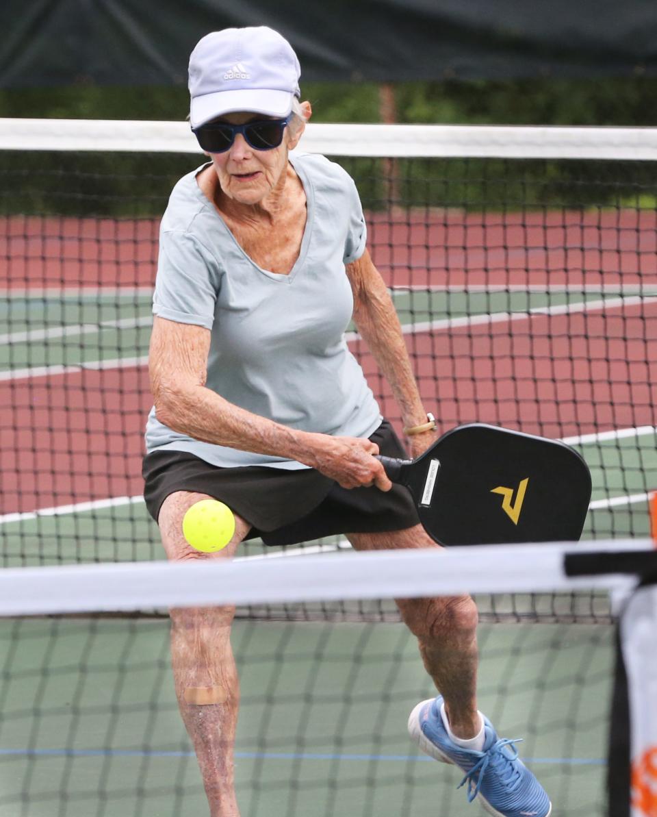 Louise Hirshberg, 93, returns a volley during a pickleball match in Exeter Friday morning, July 21, 2023. She said she was a gold medal winner in the 2018 state pickleball championship for the 80 and over category. She says Exeter needs more courts due to the wait time for players.