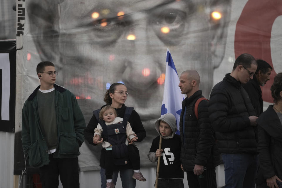 Israelis gather ahead of a protest against Prime Minister Benjamin Netanyahu's far-right government, in Tel Aviv, Saturday, Jan. 21, 2023. Last week, tens of thousands of Israelis protested Netanyahu's government that opponents say threaten democracy and freedoms. (AP Photo/ Oded Balilty)