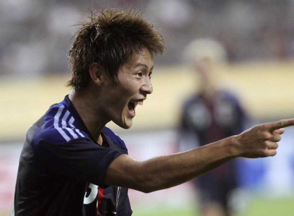 FILE - In July 21, 2013 file photo, Japan's Yoichiro Kakitani reacts after scoring a goal against China during Men's East Asian Cup soccer match at Seoul World Cup stadium in Seoul, South Korea. Kakitani's goal drought in the J-League has put his position in Japan's World Cup squad in jeopardy. Once considered a lock for Brazil, the 24-year-old attacking midfielder has yet to score for Cerezo Osaka in 10 J-League matches this season. Meanwhile his attacking partner, Uruguay veteran Diego Forlan, has scored five goals. (AP Photo/Ahn Young-joon, File)