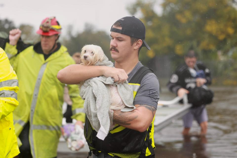 Orange County Sheriff's Deputies and first responders rescue residents and pets from flooded north Orlando neighborhood