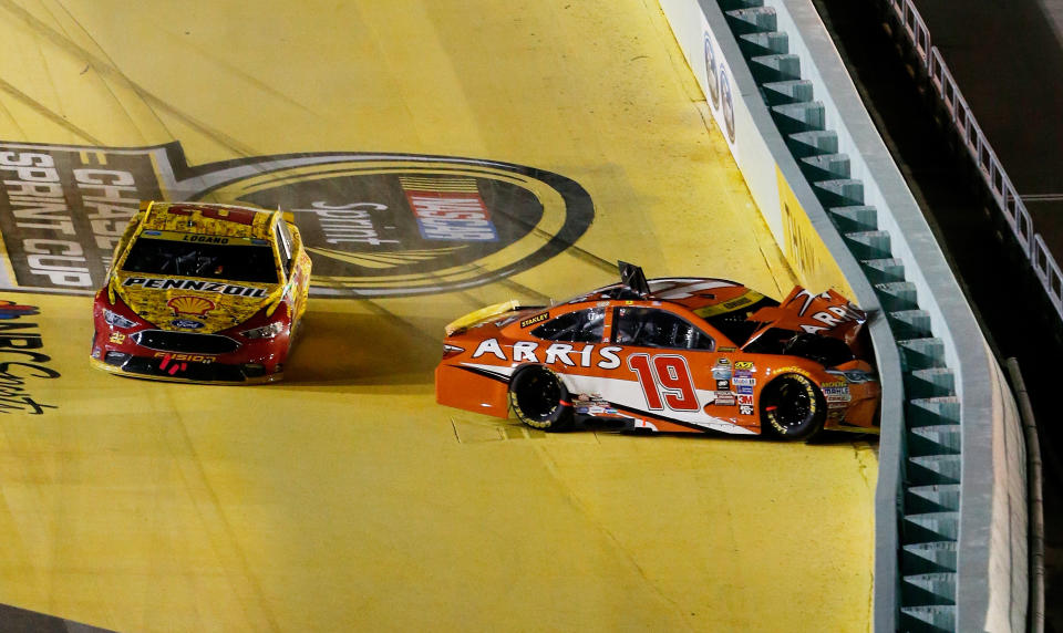 HOMESTEAD, FL - NOVEMBER 20:  Carl Edwards, driver of the #19 ARRIS Toyota, is involved in an on-track incident after making contact with Joey Logano, driver of the #22 Shell Pennzoil Ford, during the NASCAR Sprint Cup Series Ford EcoBoost 400 at Homestead-Miami Speedway on November 20, 2016 in Homestead, Florida.  (Photo by Brian Lawdermilk/Getty Images)