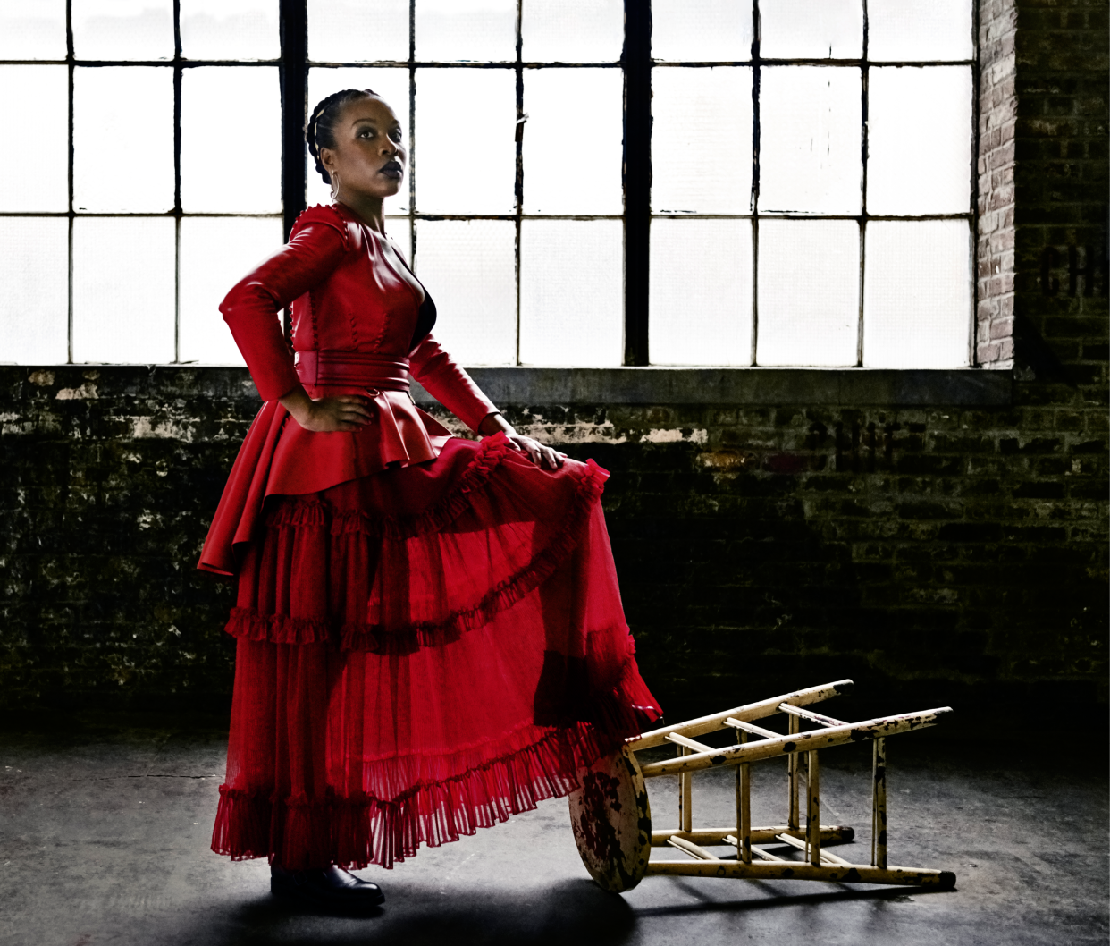 ”One of my intentions in my film making is to humanize black women and girls,” says Chukwu. Alexander McQueen jacket, skirt, and belt. Ana Khouri earring. Manolo Blahnik boots. Hair, Edris Nicholls; makeup, Janessa Par. Fashion Editor: Phyllis Posnick.