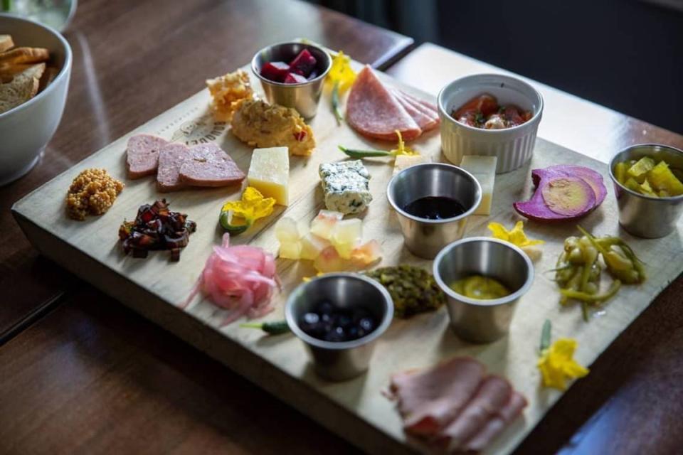 The Motherboard at Bouquet Restaurant in Covington. Chef Stephen Williams is known for his “boards” offering five different kinds featuring cured and smoked meats, cheeses, spreads and a plethora of pickled things.