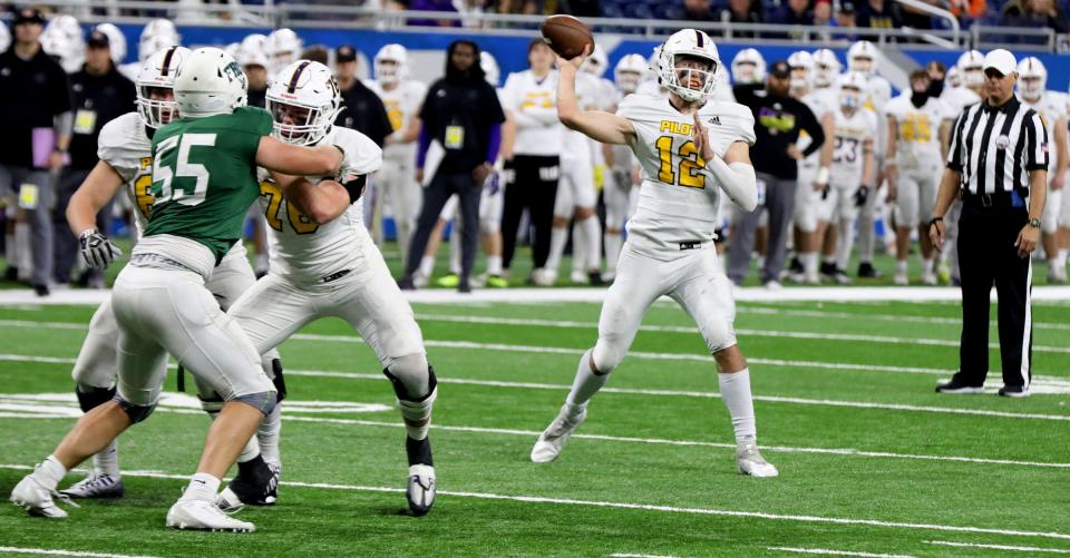 Warren De La Salle quarterback Brady Drogosh throws against Grand Rapids Forest Hills Central in the Division 2 high school football finals between the two schools at Ford Field in Detroit on Friday, Nov 25, 2022.