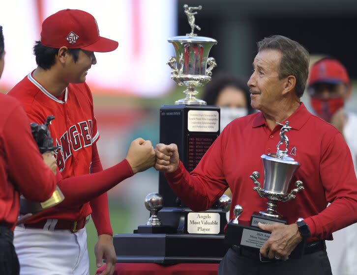 ANAHEIM, CA - SEPTEMBER 25: Shohei Ohtani #17 of the Los Angeles Angels gets a bump.