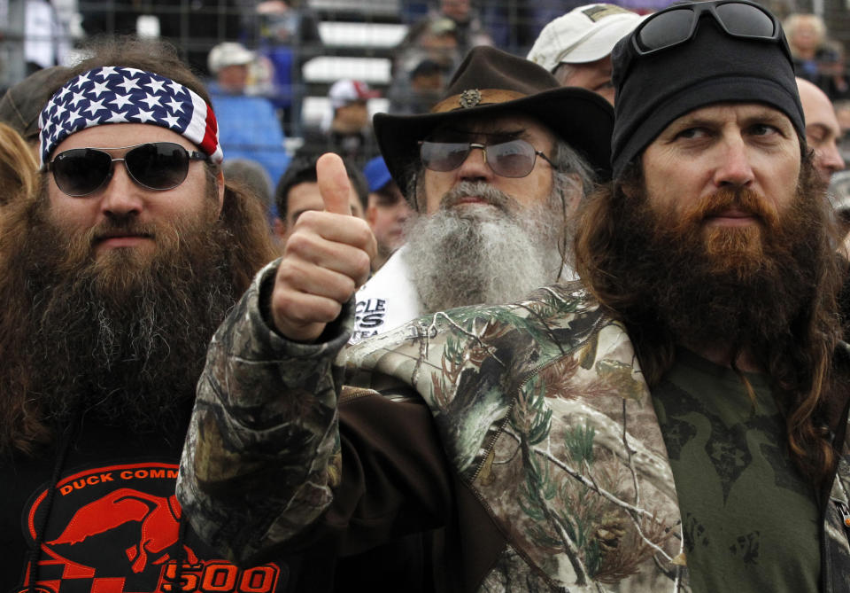 Duck Dynasty's Willie Robertson, Si Robertson and Jase Robertson before the rain delayed NASCAR Sprint Cup Series auto race at Texas Motor Speedway in Fort Worth, Texas, Sunday, April 6, 2014. (AP Photo/Mike Stone)