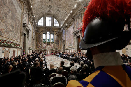 Pope Francis talks to diplomats during the traditional exchange of the New Year greetings in the Regal Room at the Vatican January 8, 2018. REUTERS/Andrew Medichini/Pool