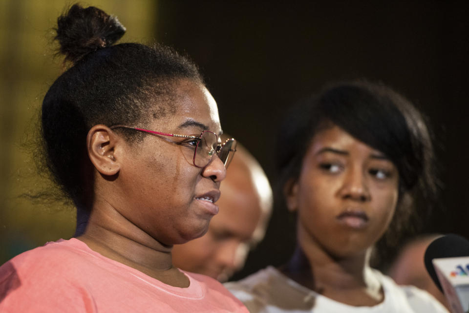 Josephine Wamah, left, with Jasmine Wamah, right, sisters of shooting victim Joseph Wamah Jr., tears up as she speaks about her brother at a news conference at Salt and Light Church in Philadelphia, Wednesday, July 5, 2023. (Allie Ippolito/The Philadelphia Inquirer via AP)