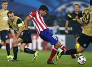 Atletico Madrid's Diego Costa (C) scores his second goal against Austria Vienna, during their Champions League Group G soccer match in Vienna October 22, 2013. REUTERS/Dominic Ebenbichler (AUSTRIA - Tags: SPORT SOCCER)