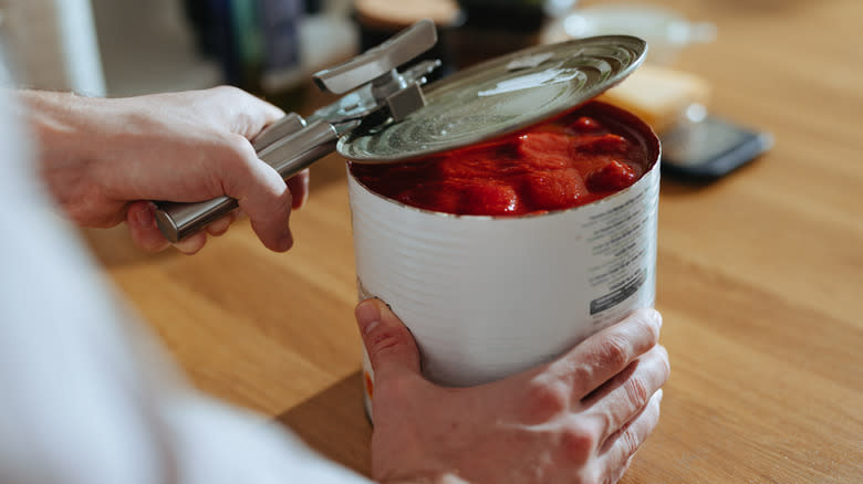 opening a can of tomatoes