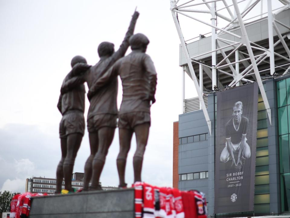 Tributes left to Sir Bobby Charlton outside the Old Trafford stadium (EPA)