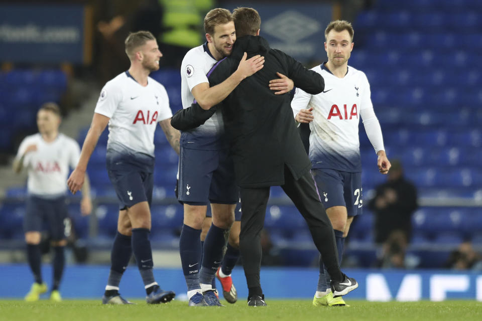 Tottenham's Harry Kane, left, hugs Tottenham coach Mauricio Pochettino at the end of the English Premier League soccer match between Everton and Tottenham at Goodison Park Stadium, in Liverpool, England, Sunday, Dec. 23, 2018. (AP Photo/Jon Super)