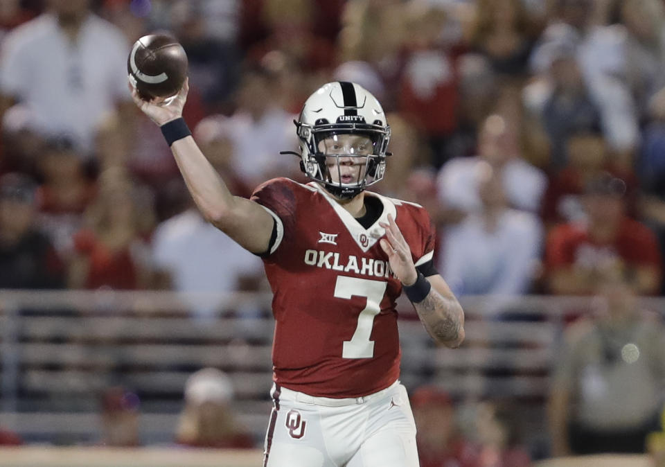 Oklahoma quarterback Spencer Rattler (7) passes against West Virginia during the second half of an NCAA college football game in Norman, Okla., Saturday, Sept. 25, 2021. (AP Photo/Alonzo Adams)