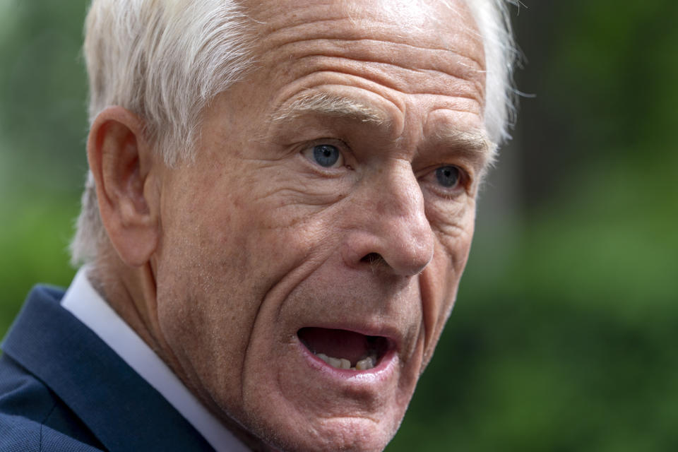 Former Trump White House official Peter Navarro speaks to the media, Friday, June 3, 2022, as he leaves federal court in Washington. Navarro was indicted Friday on contempt charges after defying a subpoena from the House panel investigating the Jan. 6 attack on the U.S. Capitol. (AP Photo/Jacquelyn Martin)