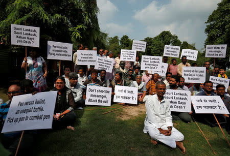 FILE PHOTO: Journalists and social activists attend a protest against the killing of Gauri Lankesh, a senior Indian journalist who according to police was shot dead outside her home by unidentified assailants in southern city of Bengaluru, in Ahmedabad, September 6, 2017. REUTERS/Amit Dave/File Photo