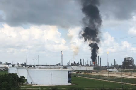 Smoke rises from a fire at Exxon Mobil's refining and chemical plant complex in Baytown