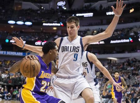 Jan 22, 2017; Dallas, TX, USA; Dallas Mavericks forward Nicolas Brussino (9) guards Los Angeles Lakers guard Louis Williams (23) during the second half at the American Airlines Center. The Mavericks defeat the Lakers 122-73. Mandatory Credit: Jerome Miron-USA TODAY Sports