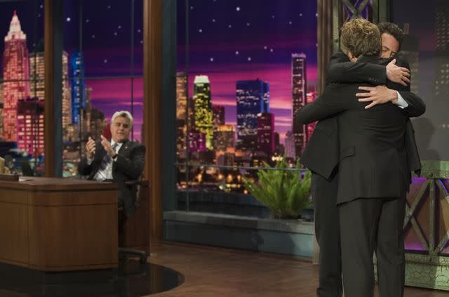 <p>Paul Drinkwater/NBCU Photo Bank/NBCUniversal via Getty</p> Matthew Perry and Bradley Whitford hug on 'The Tonight Show with Jay Leno'