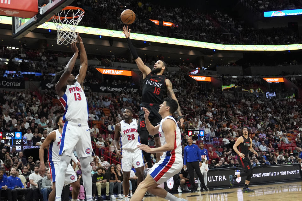 Miami Heat forward Caleb Martin (16) goes to the basket as Detroit Pistons center James Wiseman (13) defends during the first half of an NBA basketball game Tuesday, March 5, 2024, in Miami. (AP Photo/Lynne Sladky)