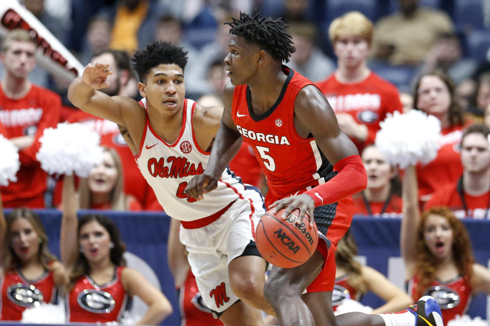 Georgia guard Anthony Edwards (5) drives against Mississippi's Breein Tyree (4) in the second half of an NCAA college basketball game in the Southeastern Conference Tournament Wednesday, March 11, 2020, in Nashville, Tenn. Georgia won 81-63. (AP Photo/Mark Humphrey)