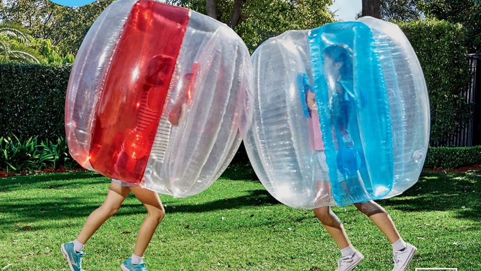 Two children ramming each other inside Aldi's bubble balls. (Image: Aldi Australia)