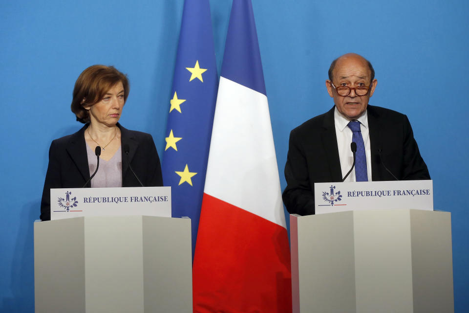 <p>French Minister for Foreign Affairs Jean-Yves Le Drian, right, and French Defense Minister Florence Parly give an official statement in the press room after attending an emergency meeting with French President Emmanuel Macron at the Elysee Palace, in Paris, France, Saturday, April 14, 2018. (Photo: Michel Euler, Pool/AP) </p>