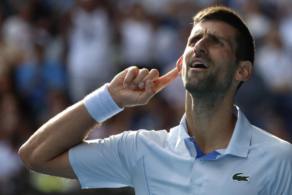 Novak Djokovic of Serbia reacts during his quarterfinal against Taylor Fritz of the U.S. at the Australian Open tennis championships at Melbourne Park, Melbourne, Australia, Tuesday, Jan. 23, 2024. (AP Photo/Asanka Brendon Ratnayake)