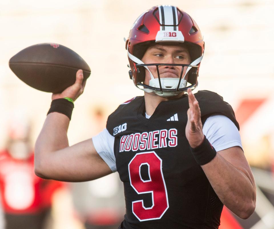 Indiana's Kurtis Rourke (9) passes during Indiana football spring practice at Memorial Stadium on Thursday, March 21, 2024.