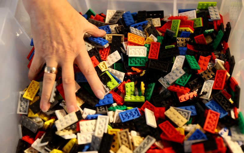 Rita Ebel, nicknamed "Lego grandma", builds a wheelchair ramp from donated Lego bricks in the living room of her flat in Hanau