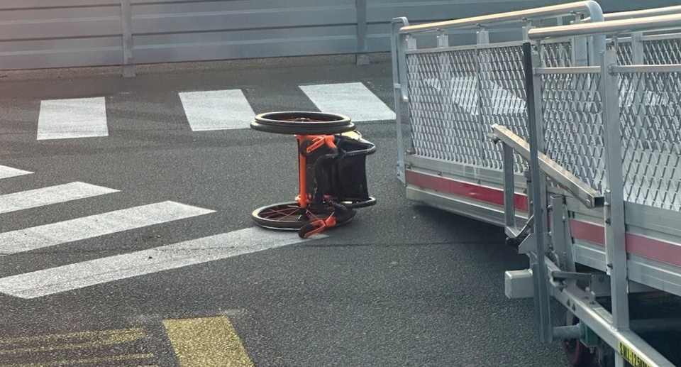 Mr Wood's discarded wheelchair on the tarmac at Brisbane Airport. 