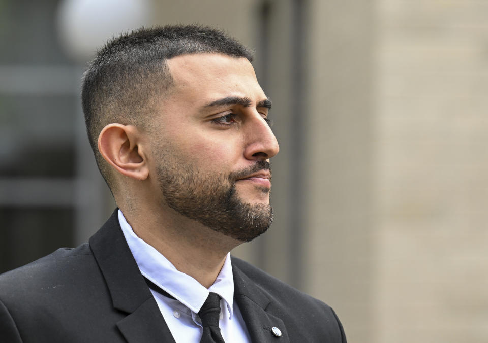 Nauman Hussain, who ran the limousine company involved in the 2018 crash that killed 20 people, walks outside during a lunch break in a new trial in Schoharie, N.Y., on Monday, May 1, 2023. Judge Peter Lynch, rejected a plea agreement for Hussain to avoid prison time. (AP Photo/Hans Pennink)