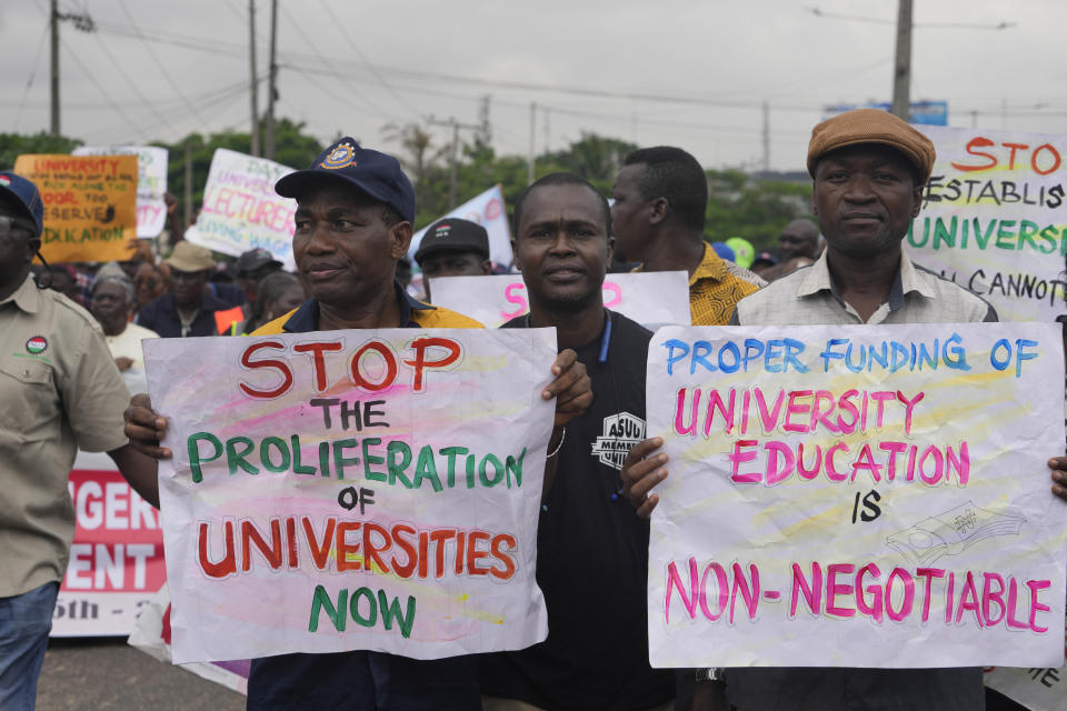 FILE - Nigeria Labour union protest in solidarity with the Academic Staff Union of Universities, on the street in Lagos, Nigeria, on July 26, 2022. A strike declared by lecturers in Nigerian public universities has now clocked six months, hurting an estimated 2.5 million students who do not have other means of learning. Such strikes are common in this West African nation with more than 100 public universities. (AP Photo/Sunday Alamba, File)