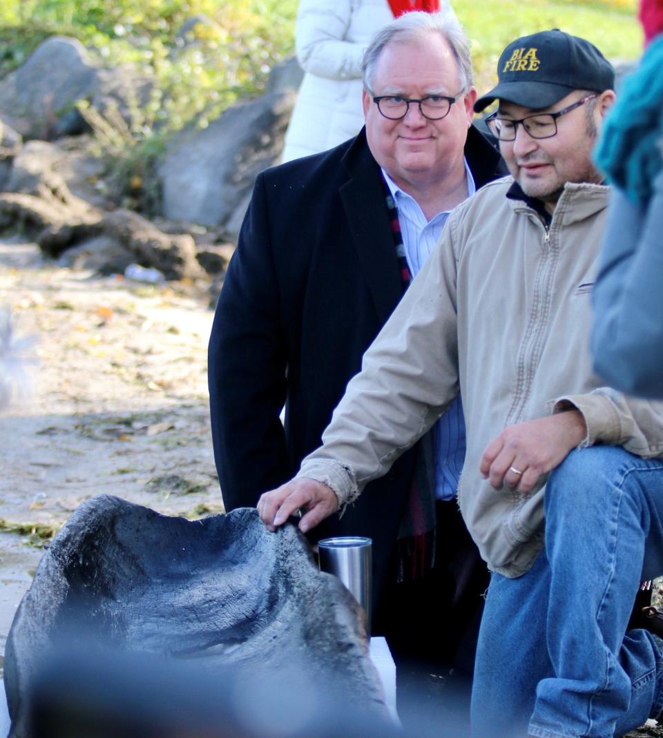 Wisconsin Historical Society Director and CEO Christian Overland with Ho-Chunk Nation Tribal Historic Preservation Officer Bill Quackenbush after a 1,200-year-old canoe was pulled from Lake Mendota.