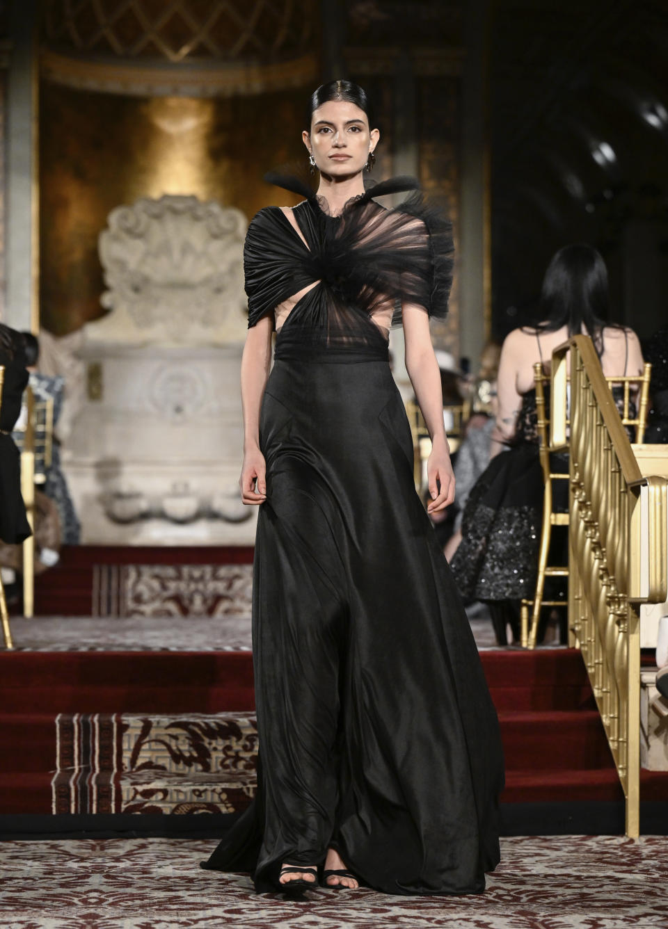 A model walks the runway during the Christian Siriano Fall/Winter 2024 fashion show at The Plaza Hotel during New York Fashion Week on Thursday, Feb. 8, 2024, in New York. (Photo by Evan Agostini/Invision/AP)