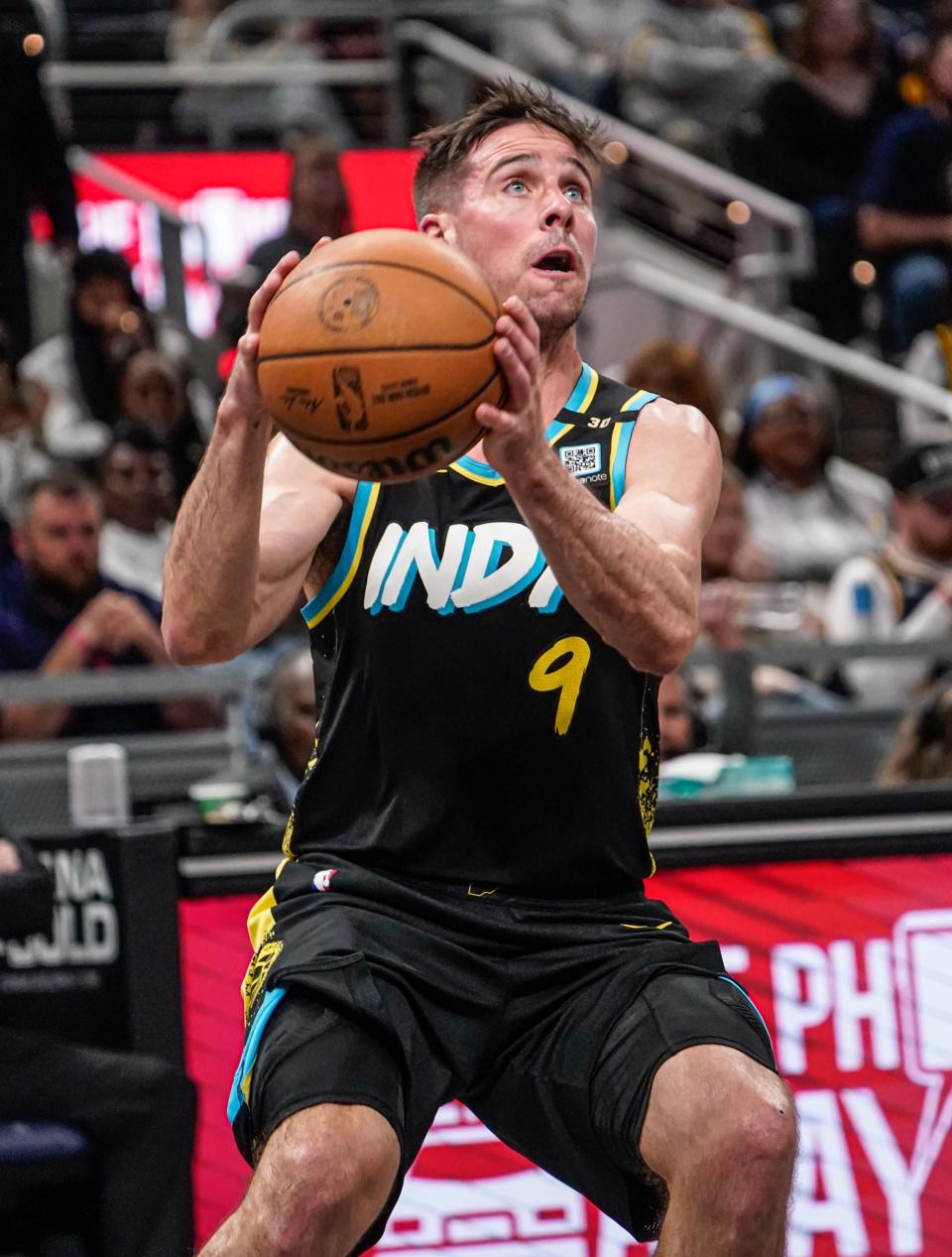 Indiana Pacers guard T.J. McConnell (9) finds a path to the basket during a game against the Miami Heat on Sunday, April 7, 2024, at Gainbridge Fieldhouse in Indianapolis.