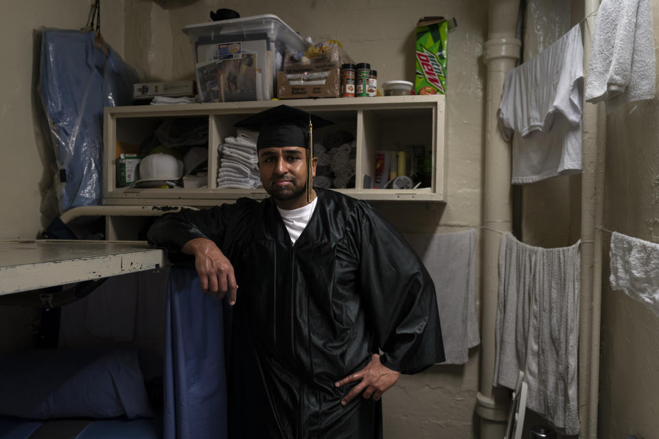 Gerald Massey, who earned a bachelor's degree in communications through the Transforming Outcomes Project at Sacramento State (TOPSS), stands for a portrait in his cell after a graduation ceremony at Folsom State Prison in Folsom, Calif., Thursday, May 25, 2023. (AP Photo/Jae C. Hong)