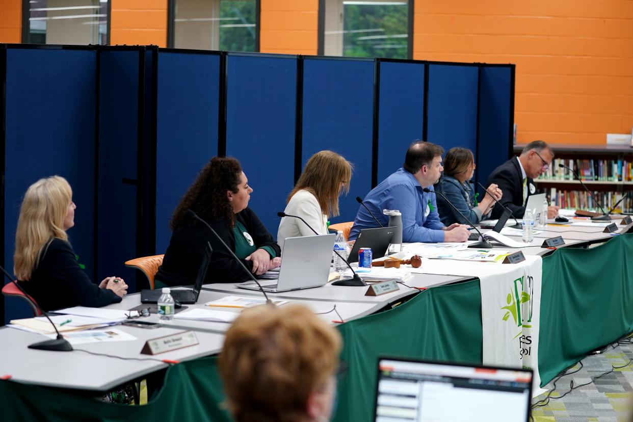 The Forest Hills School District school board begins a meeting, Wednesday, May 18, 2022, at Nagel Middle School in Anderson Township, Ohio. 